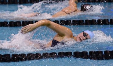 Kylie Mihok swimming in competition